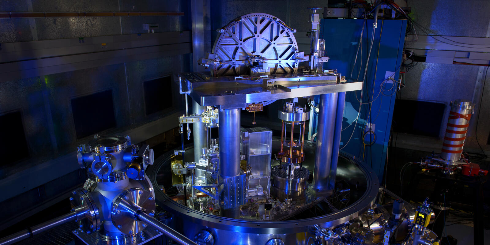 Photograph of the NIST-4 Kibble watt balance in blue light.