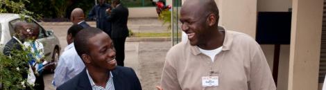 Two men talking to each other during a break at a conference