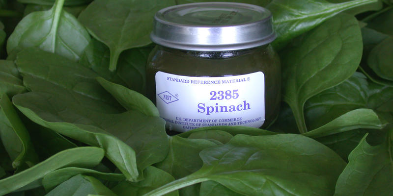 photo of NIST SRM 2385, spinach, on background of spinach leaves